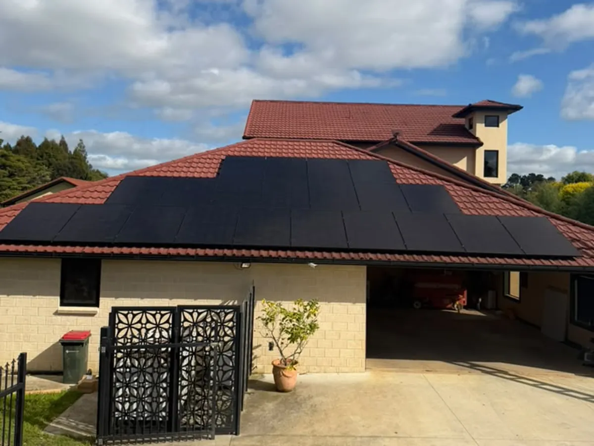 A 13.65kW EFS Solar array on a tile roof at a Buckland property, Waikato, with a tiled carport and driveway