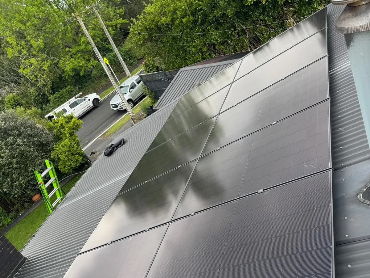 A 4.55kW EFS Solar array on a silver metal roof in Hamilton, Waikato, on a suburban street