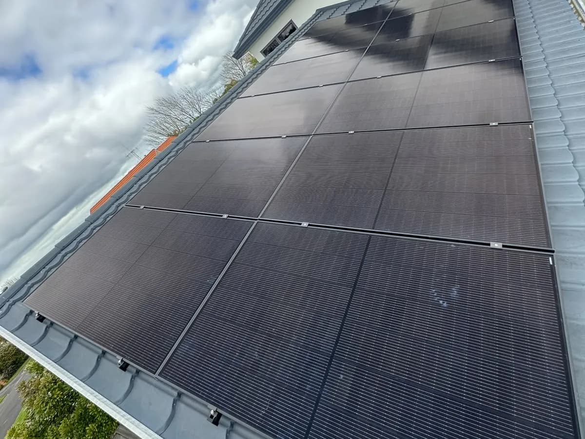 A 5.5kW EFS Solar array on a grey tile roof of a two-storey home in Hamilton, Waikato
