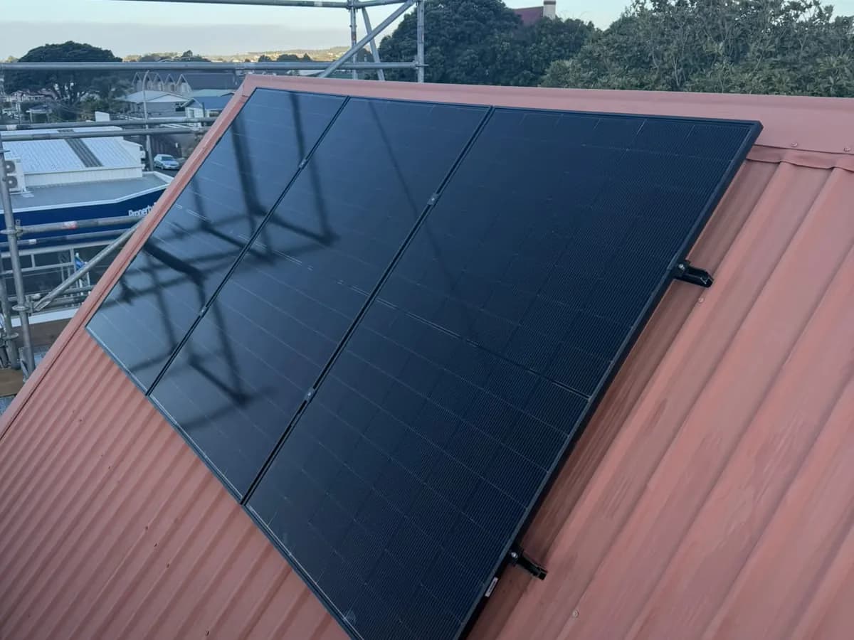A 6.83kW EFS Solar array on a red metal roof in New Plymouth, Taranaki