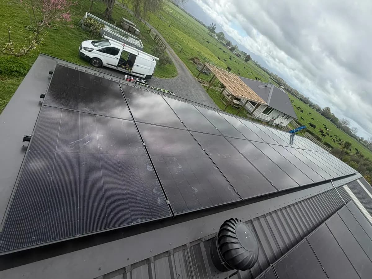 A 15kW EFS Solar array on a metal roof in Te Aroha, Waikato, with rural paddocks behind