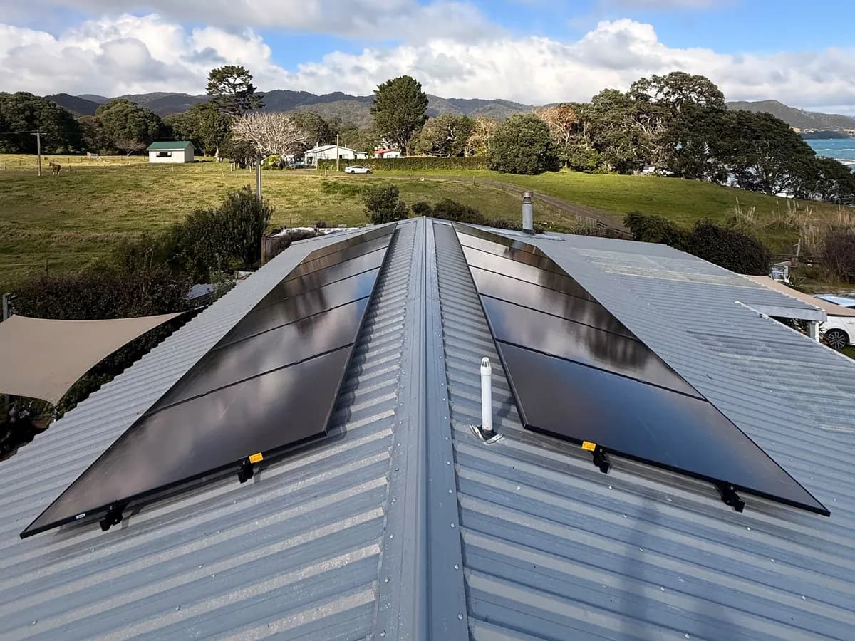 A 9.1kW EFS Solar array split either side of the ridge on a rural coastal home at Te Kaha, Bay of Plenty